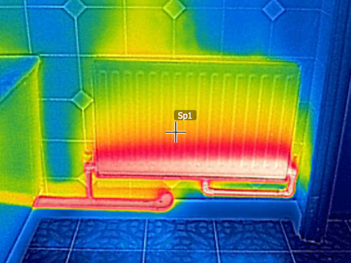 A clogged radiator that only radiates heat at the bottom.